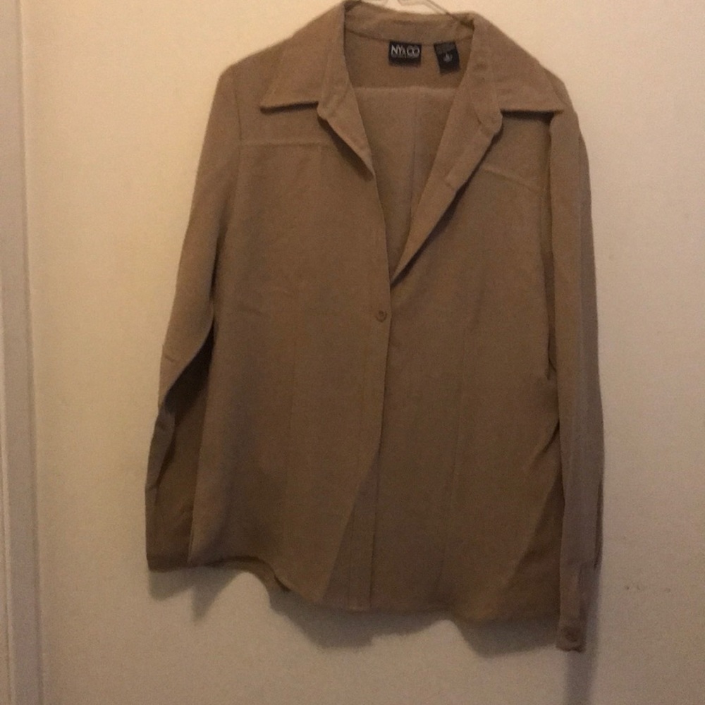 Woman tan pant suit